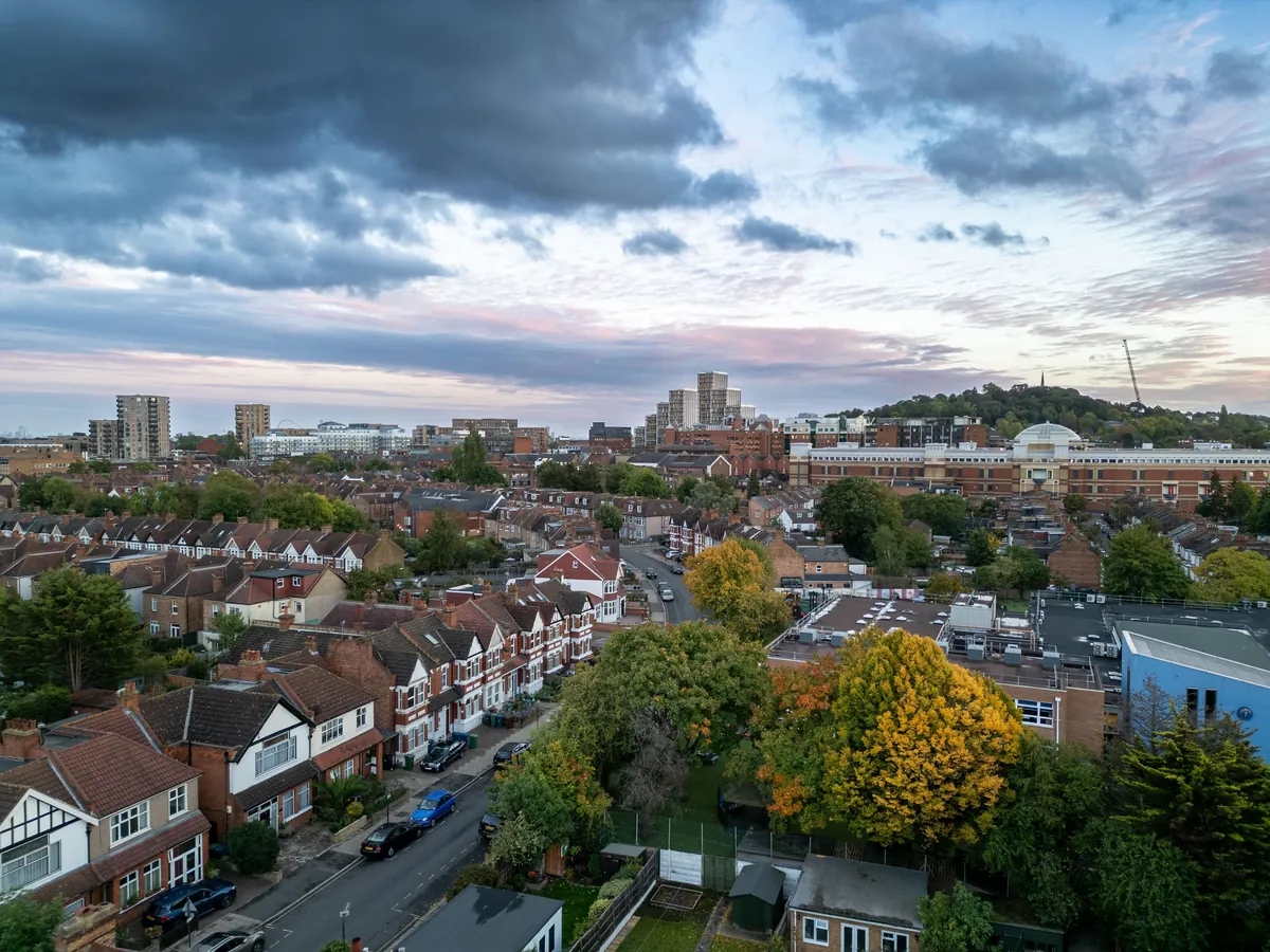 A row of London residential streets &mdash; mixed Victorian terraces and mansion blocks &mdash; in daylight, no single identifiable place.